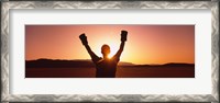 Framed Silhouette of a person wearing boxing gloves in a desert at dusk, Black Rock Desert, Nevada, USA
