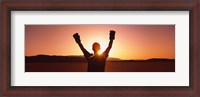 Framed Silhouette of a person wearing boxing gloves in a desert at dusk, Black Rock Desert, Nevada, USA