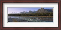 Framed Trees along a river with a mountain range in the background, Athabasca River, Jasper National Park, Alberta, Canada