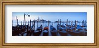 Framed Row of gondolas moored near a jetty, Venice, Italy