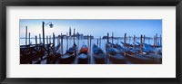 Framed Row of gondolas moored near a jetty, Venice, Italy