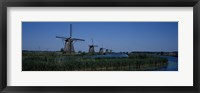 Framed Traditional windmills at a riverbank, Kinderdijk, Rotterdam, Netherlands