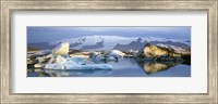 Framed Icebergs on Jokulsarlon lagoon, water reflection, Vatnajokull Glacier, Iceland.