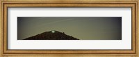 Framed Low angle view of star trails over a mountain peak, Echo Mountain, Piediluco Lake, Terni, Umbria, Italy