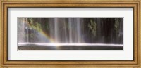 Framed Rainbow formed in front of waterfall in a forest, California, USA