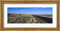 Framed Desert road passing through the grasslands, Namibia