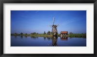 Framed Reflection of a traditional windmill in a lake, Netherlands