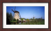 Framed Traditional windmills in a field, Netherlands