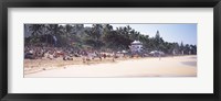 Framed Tourists on the beach, North Shore, Oahu, Hawaii, USA