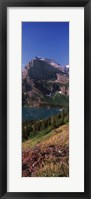 Framed Lake near a mountain, US Glacier National Park, Montana, USA