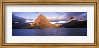 Framed Sunlight falling on mountains at the lakeside, Swiftcurrent Lake, Many Glacier, US Glacier National Park, Montana, USA