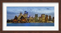 Framed Opera house and buildings lit up at dusk, Sydney Opera House, Sydney Harbor, Sydney, New South Wales, Australia
