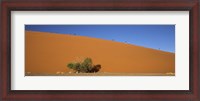 Framed Tourists climbing up a sand dune, Dune 45, Sossusvlei, Namib Desert, Namibia