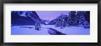 Framed Lake in winter with mountains in the background, Lake Louise, Banff National Park, Alberta, Canada