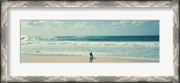 Framed Surfer standing on the beach, North Shore, Oahu, Hawaii