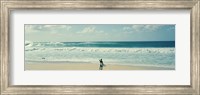 Framed Surfer standing on the beach, North Shore, Oahu, Hawaii