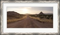 Framed Dirt road passing through a desert, Namibia