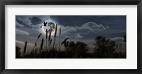 Framed Stork with a baby flying over moon