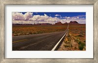 Framed Road passing through a valley, Monument Valley, San Juan County, Utah, USA