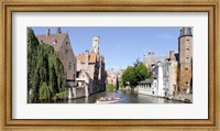 Framed Tourboat in a canal, Bruges, West Flanders, Belgium