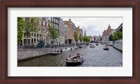 Framed Tourboats in a canal, Amsterdam, Netherlands