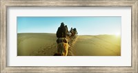 Framed Row of people riding camels through the desert, Sahara Desert, Morocco