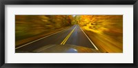 Framed Road viewed through the windshield of a moving car