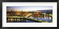 Framed Royal Palace and Parliament building lit up at dusk, Stockholm, Sweden