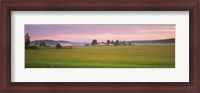 Framed Barn and wheat field across farmlands at dawn, Finland