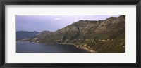 Framed Road towards a mountain peak with town, Mt Chapman's Peak, Hout Bay, Cape Town, Western Cape Province, Republic of South Africa