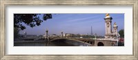 Framed Bridge across a river with the Eiffel Tower in the background, Pont Alexandre III, Seine River, Paris, Ile-de-France, France