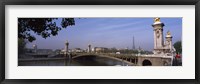 Framed Bridge across a river with the Eiffel Tower in the background, Pont Alexandre III, Seine River, Paris, Ile-de-France, France