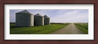 Framed Three silos in a field