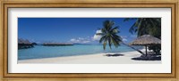 Framed Lounge chair under a beach umbrella, Moana Beach, Bora Bora, French Polynesia