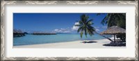 Framed Lounge chair under a beach umbrella, Moana Beach, Bora Bora, French Polynesia