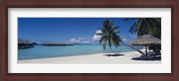 Framed Lounge chair under a beach umbrella, Moana Beach, Bora Bora, French Polynesia