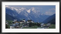Framed High angle view of a village on a landscape and a mountain range in the background, St. Anton, Austria