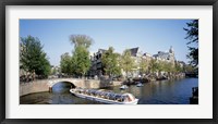 Framed Netherlands, Amsterdam, tour boat in channel