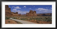 Framed Empty road running through a national park, Arches National Park, Utah, USA