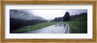 Framed Wet highway passing through a forest, Austria