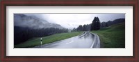 Framed Wet highway passing through a forest, Austria