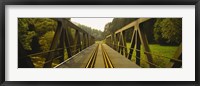 Framed Railroad tracks passing through a bridge, Germany