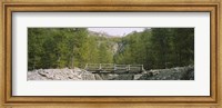 Framed Wooden footbridge across a stream in a mountain range, Switzerland