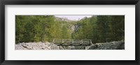 Framed Wooden footbridge across a stream in a mountain range, Switzerland