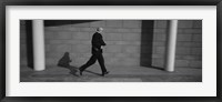 Framed Side Profile Of A Businessman Running With A Briefcase, Germany