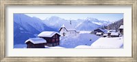 Framed Snow Covered Chapel and Chalets Swiss Alps Switzerland