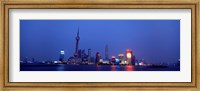 Framed Buildings at the waterfront lit up at dusk, Pudong, Shanghai, China