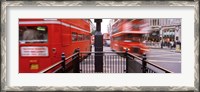 Framed Double-Decker buses on the road, Oxford Circus, London, England