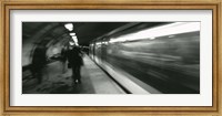 Framed Subway train passing through a subway station, London, England
