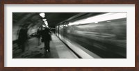 Framed Subway train passing through a subway station, London, England